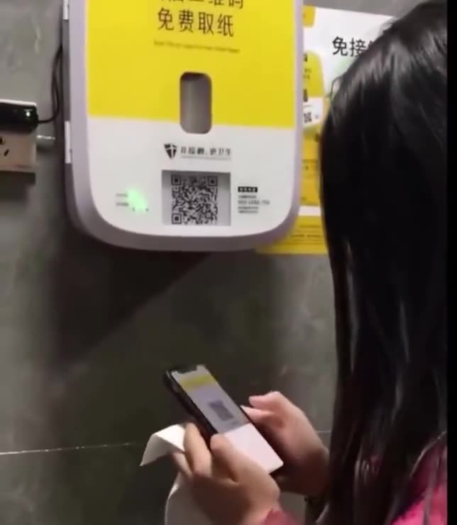 Public restrooms in China are beginning to require people to watch ads, in order