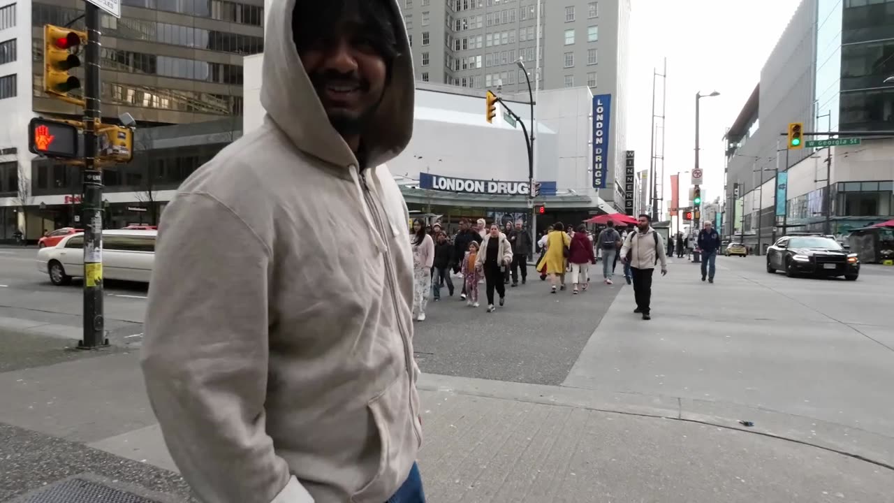 Young Man stops for Preacher while everyone else walks away