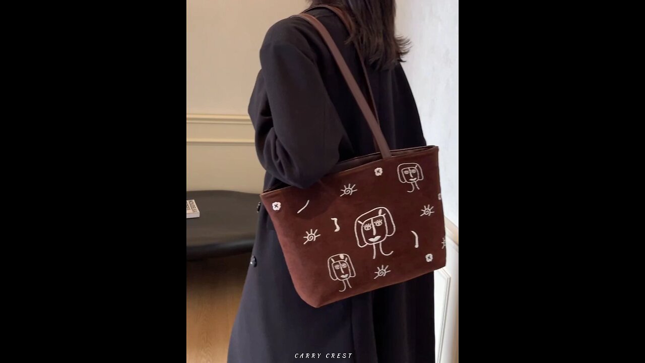 Stylish Suede Tote Bag with Unique Abstract Face Design