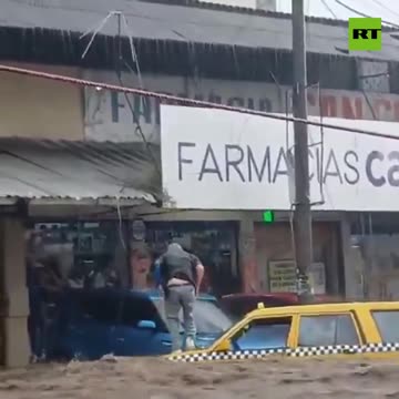 Taxi driver climbs for his life as rushing flood waters fill car cabin