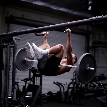 Pull-ups on a crossbar with a barbell