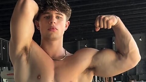 18 years old bodybuilder flexing muscles