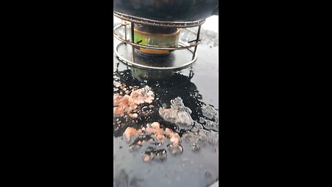 alcohol stove made with two pop cans cooking eggs