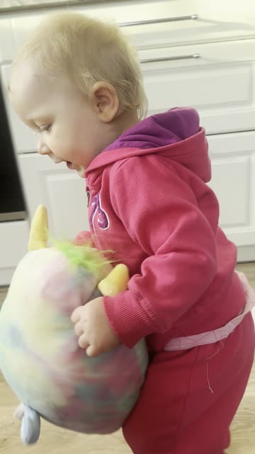 Baby Kayla Walking with Her Fluffy Toy – Too Cute! 🧸