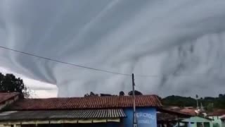 Massive thundercloud engulfs Brazilian towns, creating terrifying visuals.