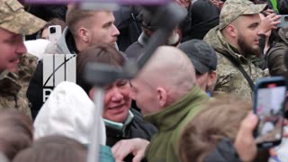 Soldier after years in captivity, holds his child in his arms for the first time.