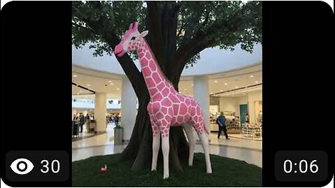 Pink Giraffe Eating Apple inside the Mall Tree