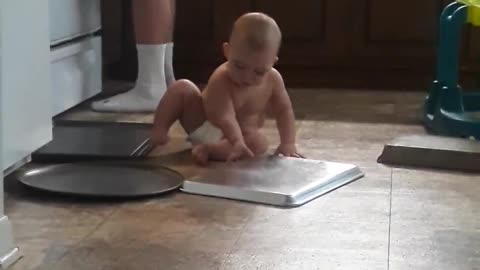 Jasper playing with pans