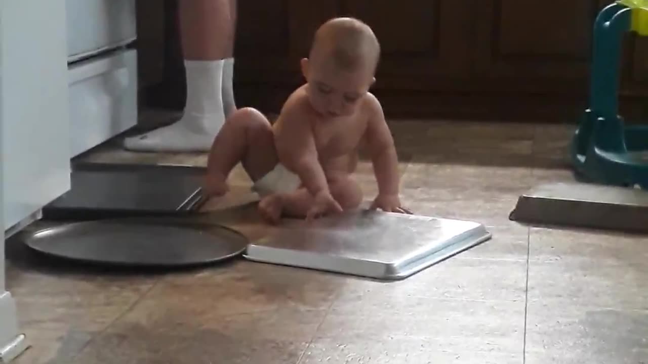 Jasper playing with pans