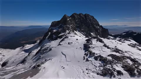 Free Flight over snowcapped mountains for 30 seconds. #drone #nature