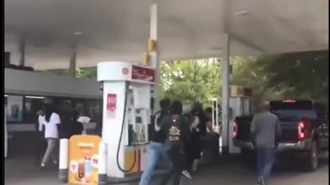 Shell Station Showdown: Protesters Swarm Moving Truck