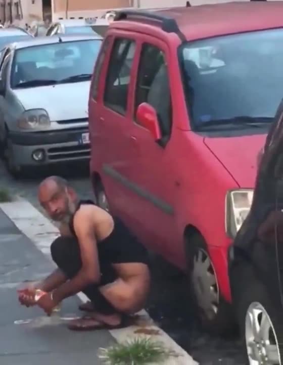 Illegal migrant pooping in public in Italy