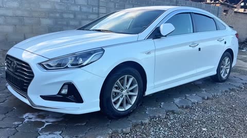 washing the car covered in mud