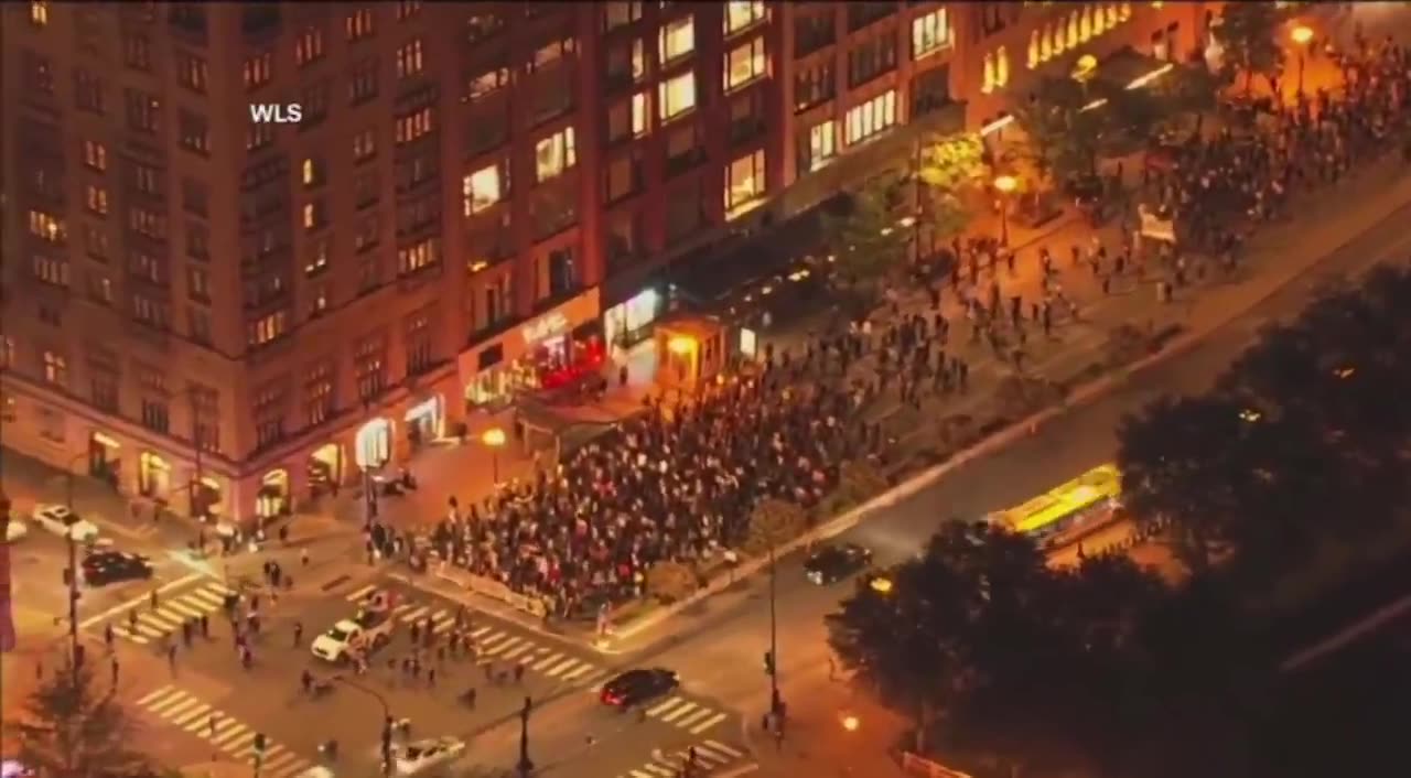 Hundreds of anti-ICE protesters march through downtown Chicago, Illinois.