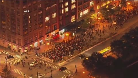 Hundreds of anti-ICE protesters march through downtown Chicago, Illinois.