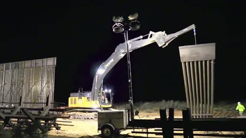 Building the wall at night