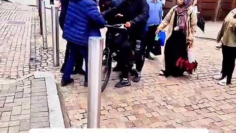 Two "boys" try to steal a bike..