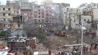 Rescue workers pull bodies from Lebanon building collapse