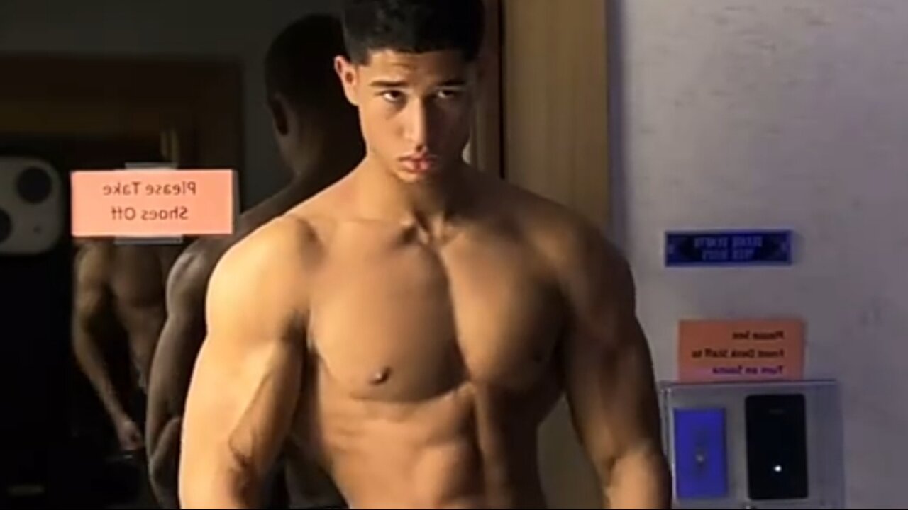 18 years old Bodybuilder flexing muscles