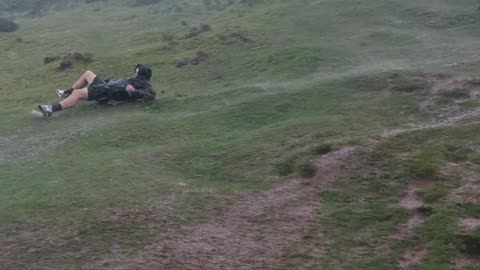 Crazy Weather Sends Man Sliding Down Hill