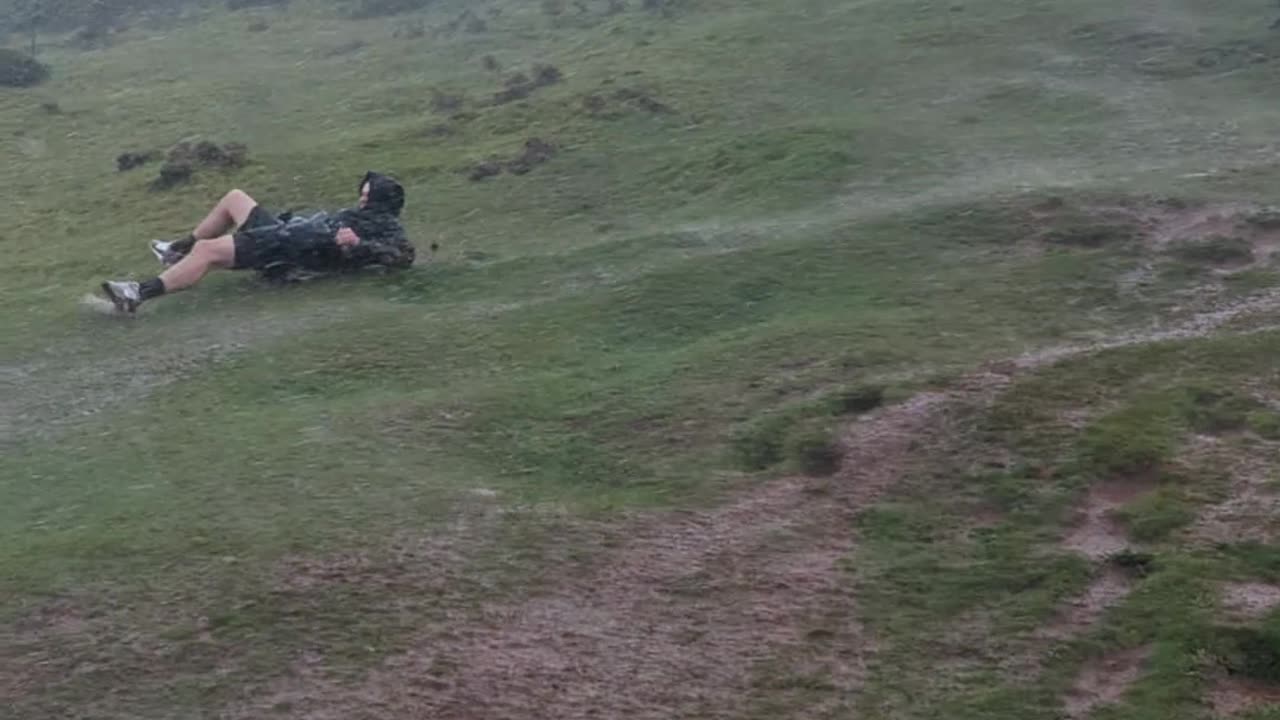Crazy Weather Sends Man Sliding Down Hill
