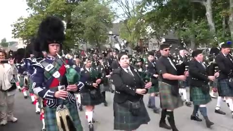 Massed Pipes & Drums parade through Deeside