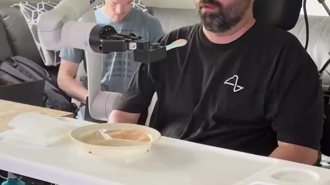 NEURALINK ENABLED A PARALYZED MAN TO CONTROL A ROBOTIC ARM AND FEED HIMSELF USING ONLY HIS THOUGHTS