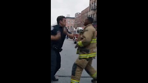 Police officer fights, a firefighter in a fist fight
