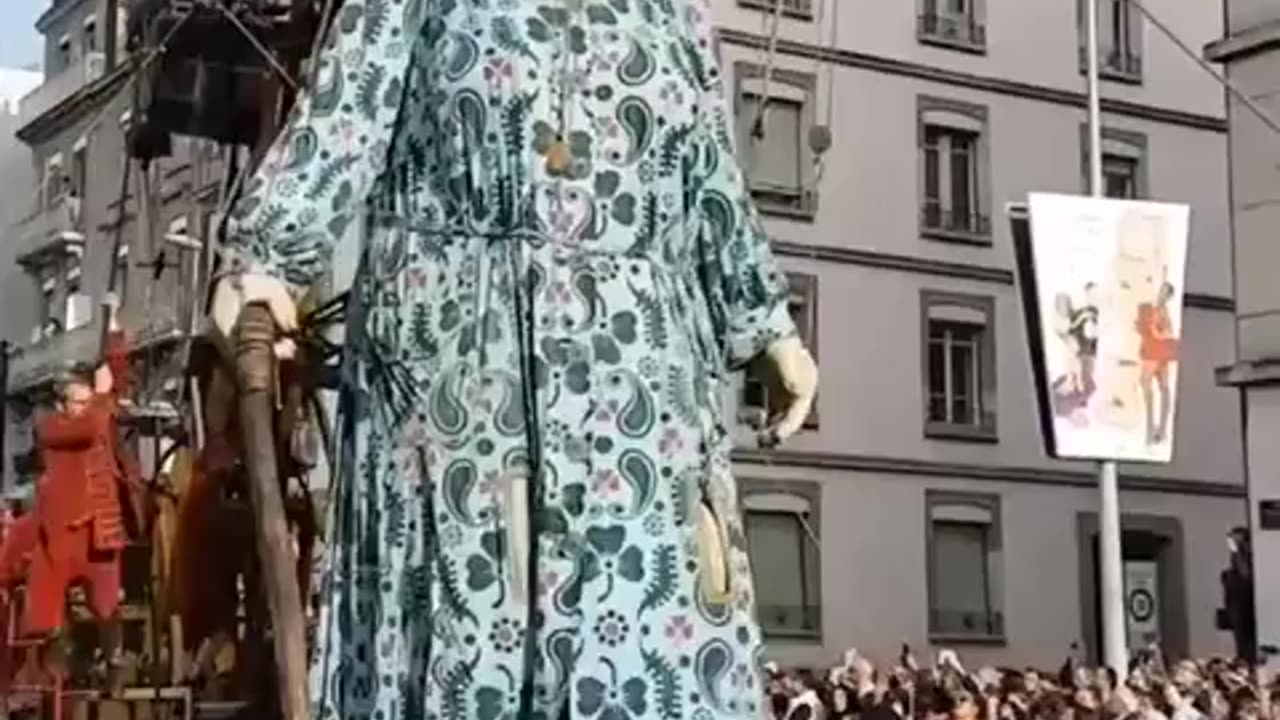A giant puppet walks through the streets of Geneva during a parade in Switzerland