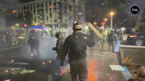 Portland, Oregon, Federal police deploy tear gas and crowd control munitions outside an ICE facility