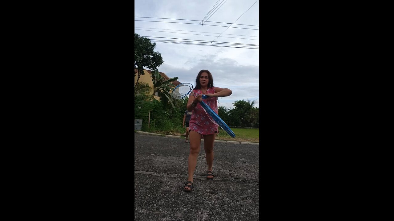 Playing Badminton with my friend..