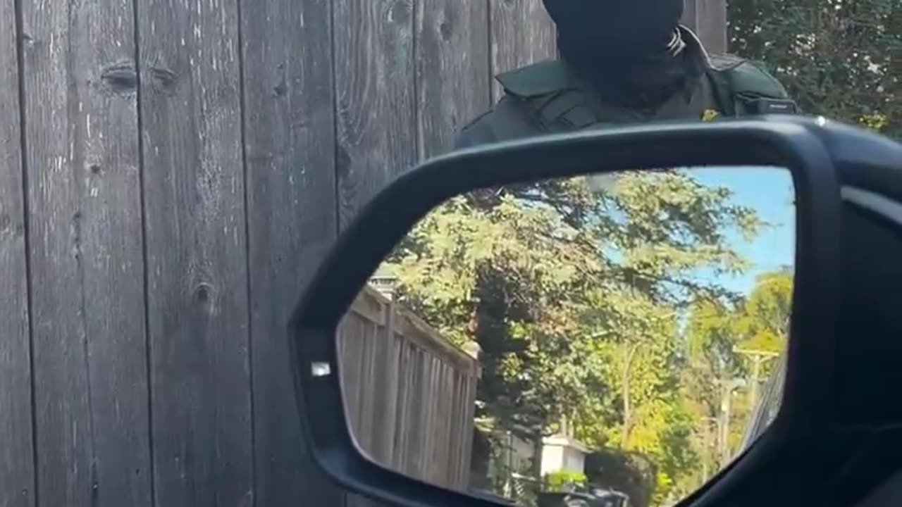 DHS agent tells a woman tailing them to stop impeding their operations or she will be arrested.