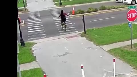 Man Rides Bicycle Into Street With Fists In The Air...