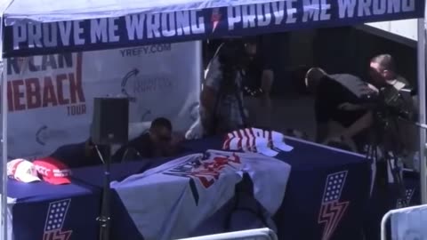A viral video shows several men rushing the stage right after the Charlie Kirk assassination
