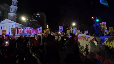 Palestinian woman protests against Netanyahu/Trump outside the White House.