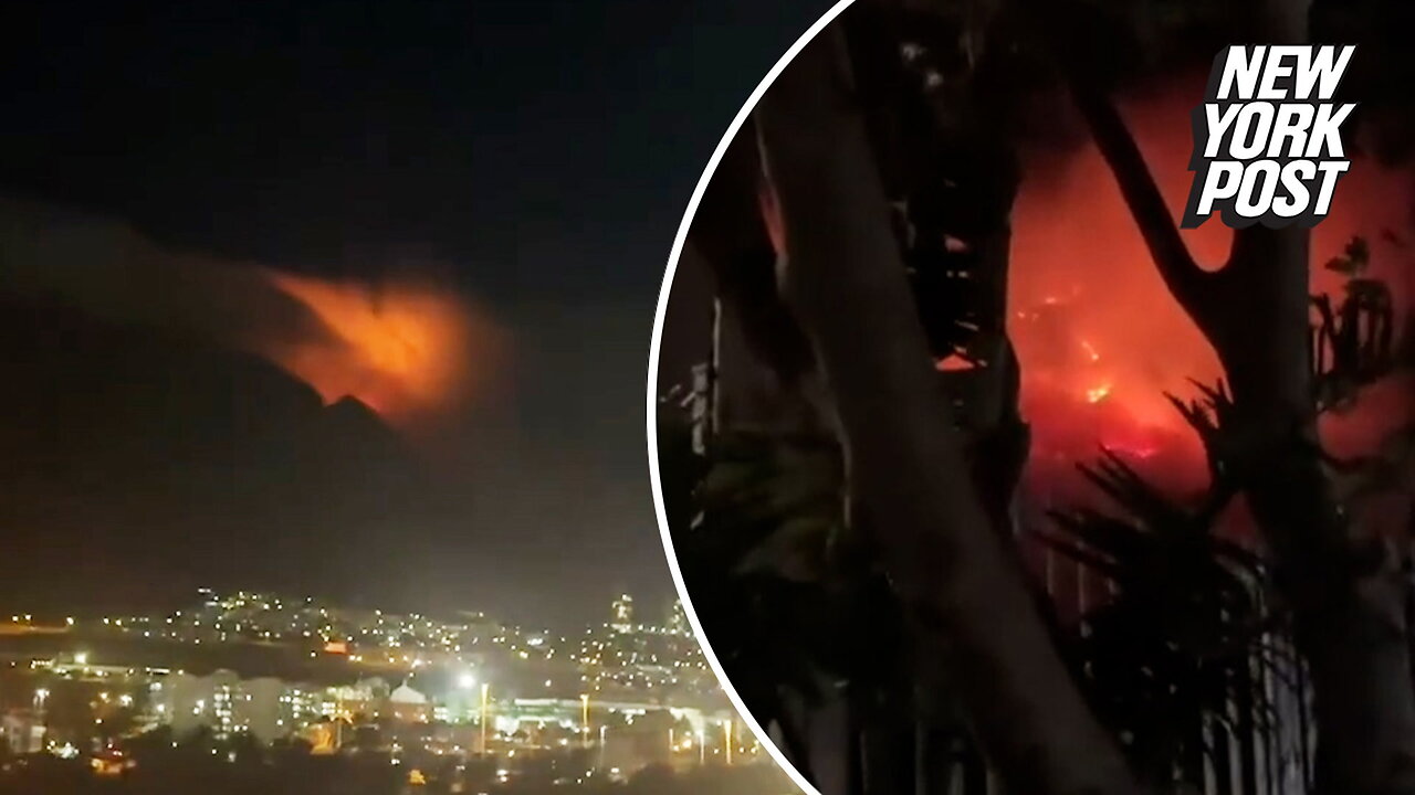 South Africa's iconic Table Mountain 'glowing' as wildfires are fanned by strong winds
