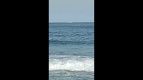 Boat 🚢 sailing the ocean waves 🌊 on Long Beach Island New Jersey