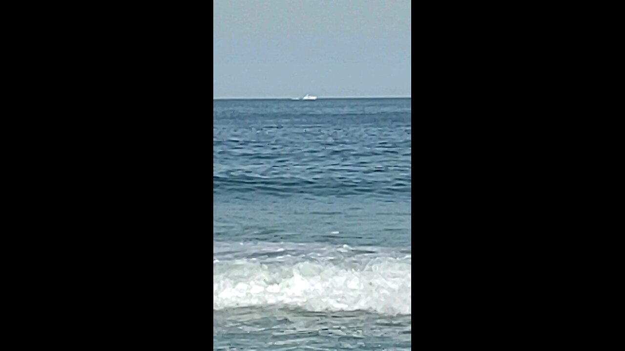 Boat 🚢 sailing the ocean waves 🌊 on Long Beach Island New Jersey