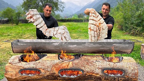 Cooking Atlantic salmon in a huge log grill! A way of cooking like savages