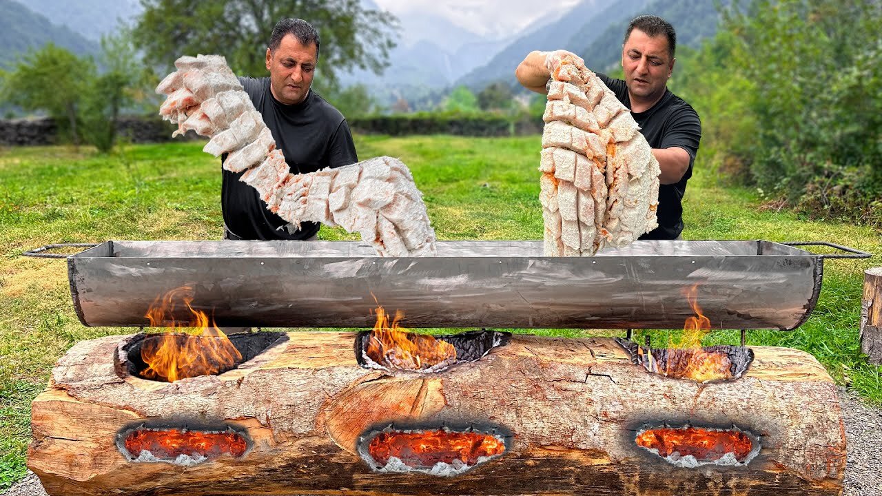 Cooking Atlantic salmon in a huge log grill! A way of cooking like savages