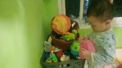 Busy looking for toys in the basket