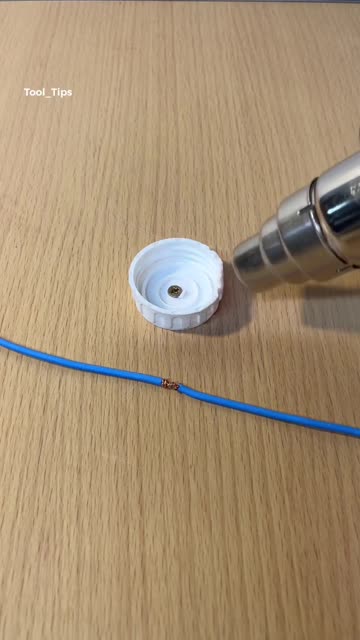 Heat Gun Used for Wire Insulation Repair with Plastic Cap