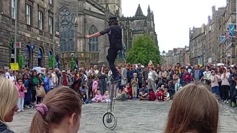 SWORD JUGGLER ON UNICYCLE