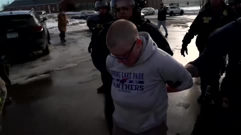 ICE agents arrest protest singer in tense Minneapolis standoff