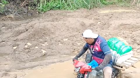 motorbike submerged in a mud puddle