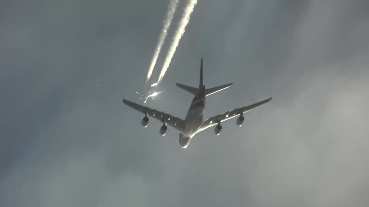2 passing airplanes in the sky at once-Airbus A380 and Airbus A330