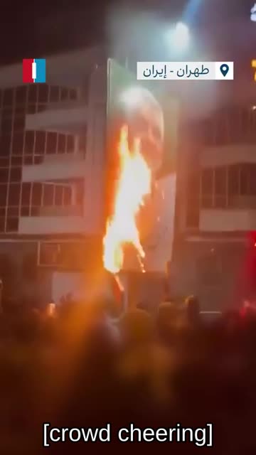 🇮🇷 🔥 Iran on Fire: Participants in the protests are burning portraits of Soleimani
