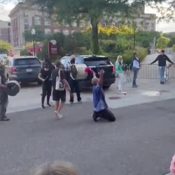 Unhinged Leftist protestor chants "go home Nazi scum" outside of a TPUSA in Minneapolis...