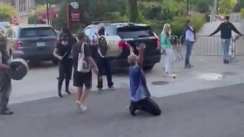 Unhinged Leftist protestor chants "go home Nazi scum" outside of a TPUSA in Minneapolis...