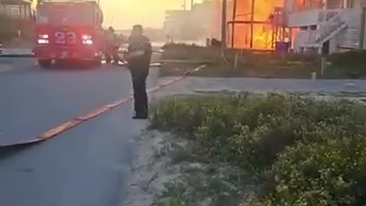 5 houses burning across from Trailer bar in Surf city